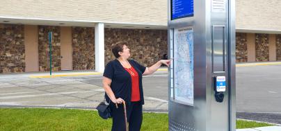 Image of woman viewing map on a Pulse tower