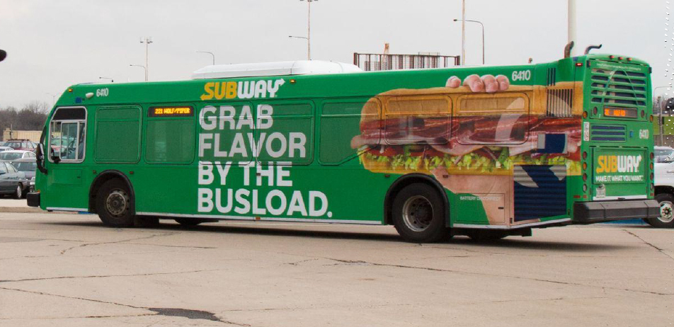 Image of a full bus wrap advertisement on a Pace bus