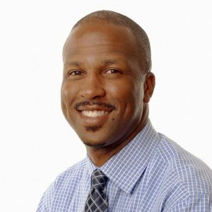 man in striped shirt and necktie