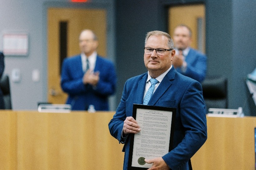 Pace Chairman Rick Kwasneski is pictured receiving a resolution honoring his 24 years of service to Pace.