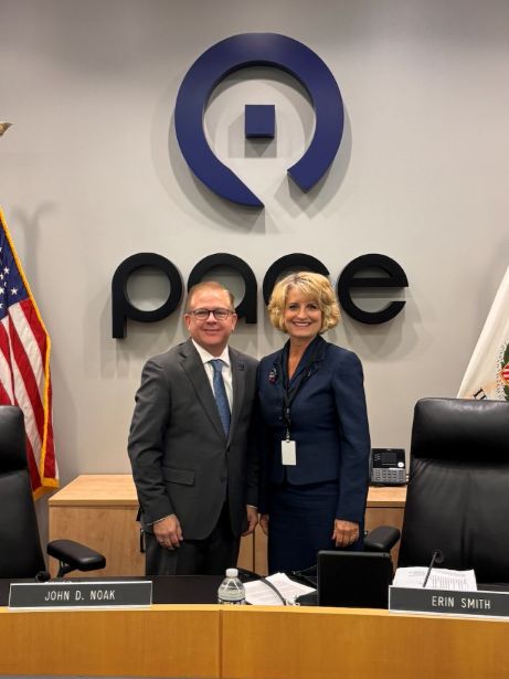 Newly elected Chairman John Noak standing alongside Director Erin Smith with Pace logo in the background.
