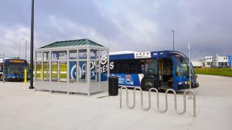 A bus pulls up to I-90/Randall Rd. Station