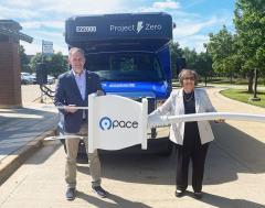 Congressman Sean Casten and Pace Executive Director Melinda Metzger in front of Pace’s first electric paratransit bus.